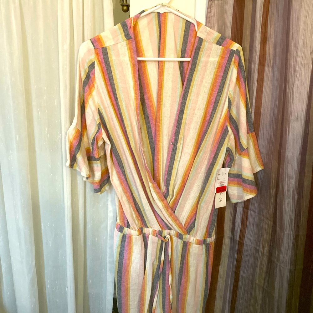 Never Worn. 3 Quarter Sleeve Bathing Suit Cover or Very Low Rise Romper.
